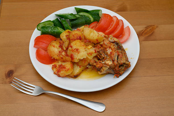 Hearty chicken Ojakhuri featuring golden potato wedges, tender marinated chicken, and sweet caramelized onions. This one-pan Georgian comfort food embodies warmth and togetherness.