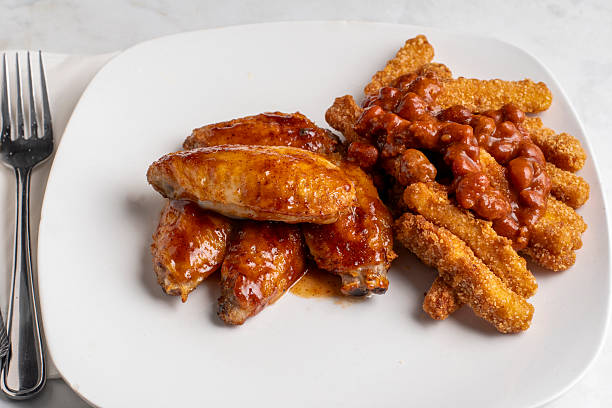 istock chicken wings   with chicken chilli fries 2247912103