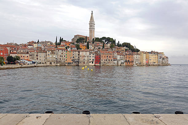 Rovinj, Croatia - October 15, 2014: Picturesque Old Town Peninsula at Adriatic Sea Istria Travel Cloudy Autumn Day.