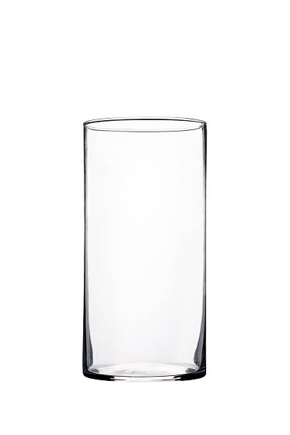 istock Transparent tall cylindrical glass vase isolated on white background for interior decor, floristry, and modern minimalist design concepts. 2247914815