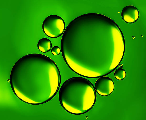 istock Abstract background, green oil drops on water surface. Beautiful, natural macro abstract wallpaper. 2247916646