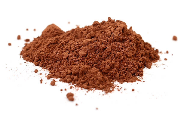 istock Cocoa powder heap isolated on white 2247922135