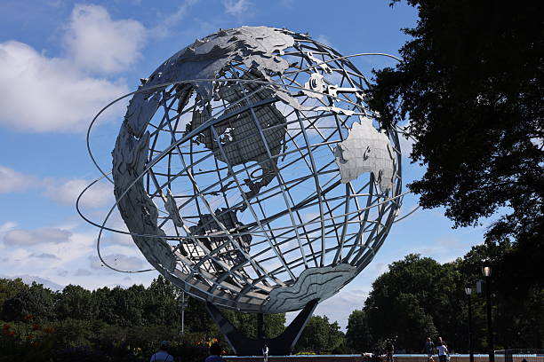 Queens, New York. Taken August 21, 2025. Flushing Meadows Corona Park during US Open 2025 - August day. The Unisphere at the park visible in the shot. US Open is held in the stadium within the park. The globe was designed by Gilmore D. Clarke for the 1964 New York World's Fair. Commissioned to celebrate the beginning of the space age, the Unisphere was conceived and constructed as the theme symbol of the World's Fair.
