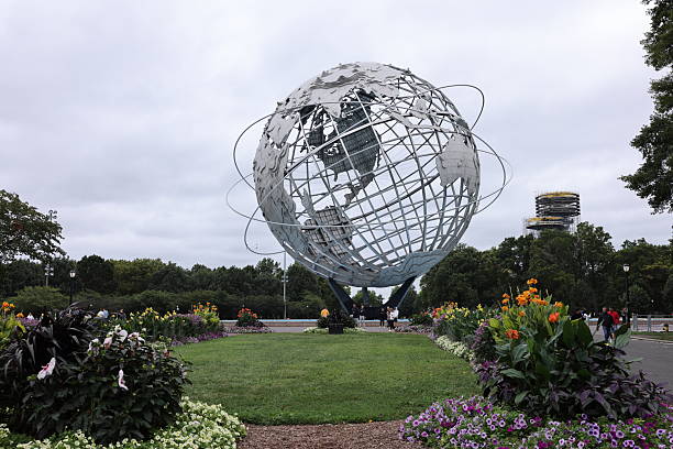 Queens, New York. Taken August 21, 2025. Flushing Meadows Corona Park during US Open 2025 - August day. The Unisphere at the park visible in the shot. US Open is held in the stadium within the park. The globe was designed by Gilmore D. Clarke for the 1964 New York World's Fair. Commissioned to celebrate the beginning of the space age, the Unisphere was conceived and constructed as the theme symbol of the World's Fair.