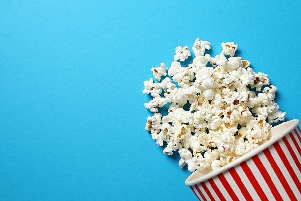 istock top view of fresh popcorn in buscket on blue background 2247925494
