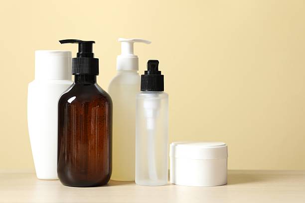 istock jar, bottle and empty white plastic tubes for cosmetics on a yellow background. Packaging for cream, gel, serum, advertising and product promotion, mock up 2247925530
