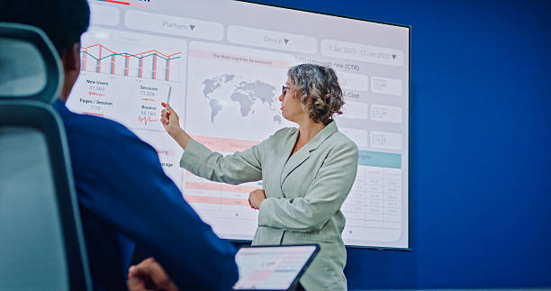 istock Diverse business team presents company data and performance charts meeting discussing strategy planning investment marketing strategies in modern office. Sustainable business and finance concept. 2247928734