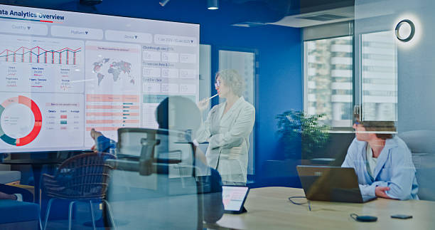 istock Diverse business team presents company data and performance charts meeting discussing strategy planning investment marketing strategies in modern office. Sustainable business and finance concept. 2247928735