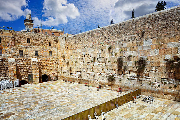 Jerusalem, Israel - April 24, 2019:  Crowded Western Wall - Wailing Wall or short 'the Kotel' in Jerusalem. Crowd of Jews praying and walking at the Western Wall - Wailing Wall - Klagemauer during the Passover Celebration Days. Wailing Wall - Western Wall, Jerusalem Old City, Israel, Middle East.