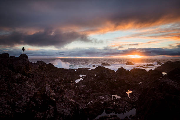 Waves crash on rocky coastline at sunset, Chesterman Beach, Pacific Rim National Park, Tofino, Vancouver Island, B.C.