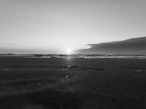 istock Black and White Sunset Over Ocean Waves at Cannon Beach, Oregon 2247939966