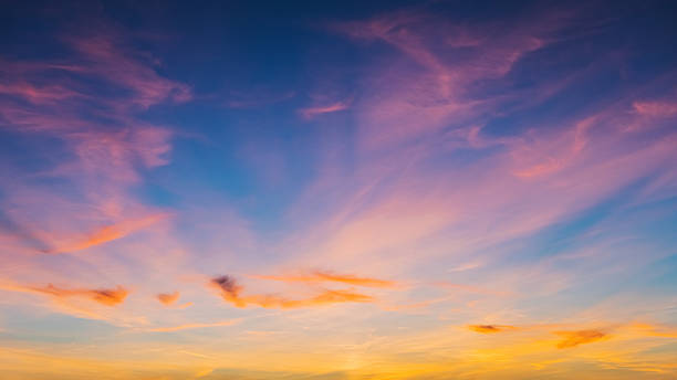 istock Pink and yellow clouds in sky 2247943087