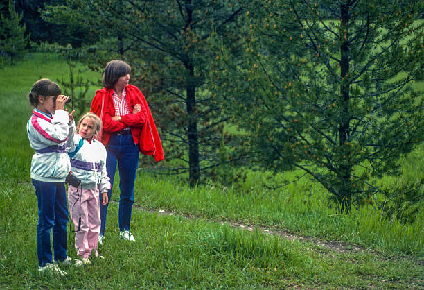 Glacier NP - Mother & Daughters Look at a Deer - 1989