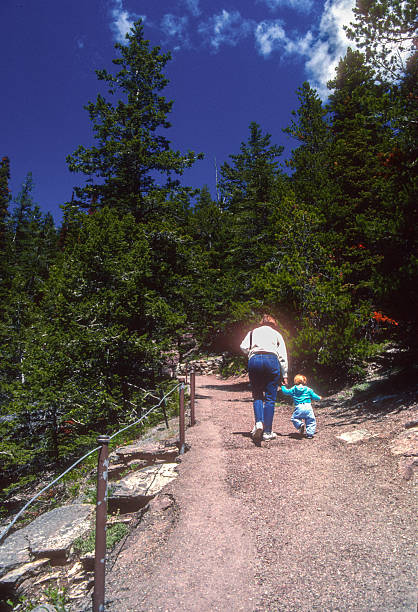 istock Glacier NP - Mother & Son on St. Mary's Falls Trail - 1989 2247944197