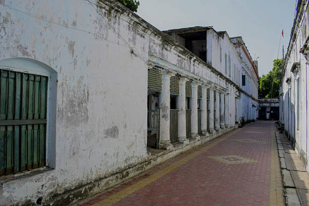 murshidabad, west bengal, india- november 19, 2025: weathered white walls and columned corridors of the 'nasipur akhra' forming a long, quiet walkway