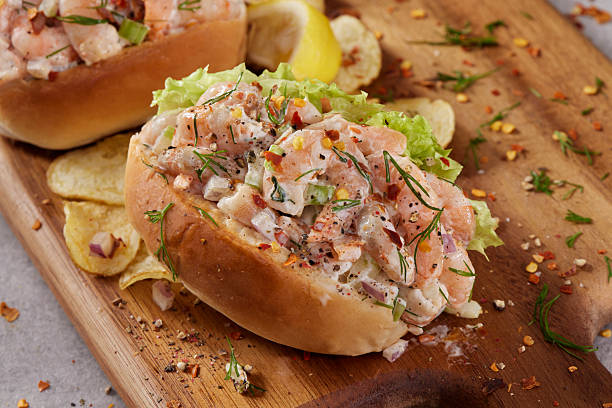 Creamy Shrimp Salad  Sliders on Soft Buns with celery, Green Pepper, Chili Flacks a squeeze of Lemon Juice and Potato Chips