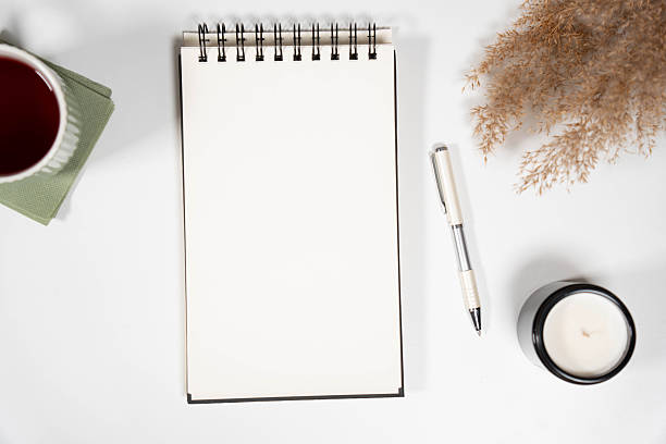 istock Vertical Blank Notebook Mockup with Dried Flowers and Candle 2247948030