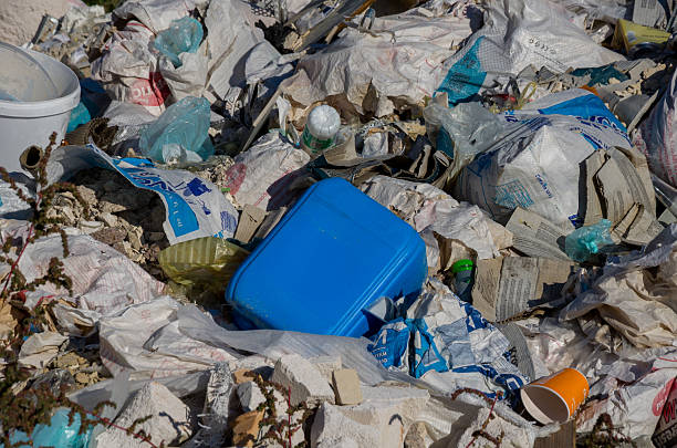 istock Illegal Dumping Site Close-up of Mixed Plastic, Paper, and Construction Waste Pile. 2247949599