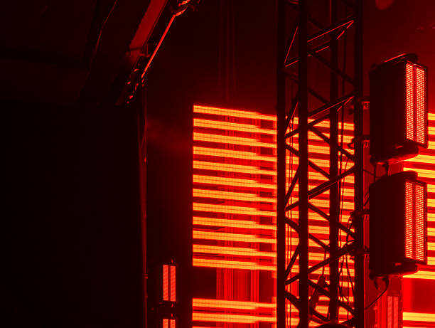 istock Concert stage lighting with red LED screen and truss 2247952185