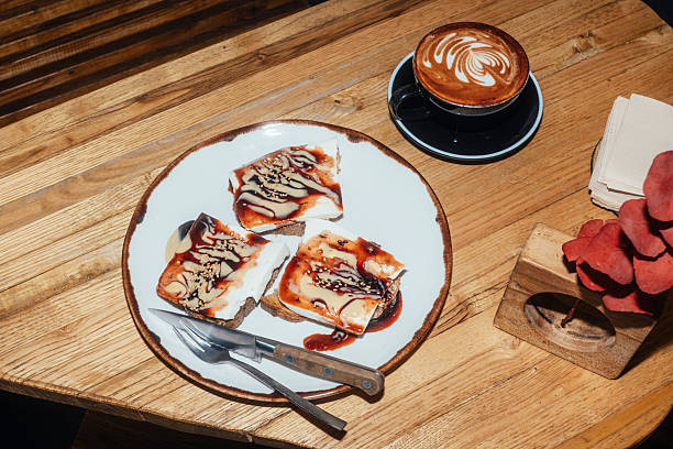 istock Overhead view of toast plate and latte. 2247953239