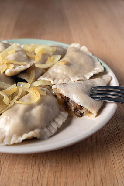 Polish dumplings with visible cabbage and mushroom filling