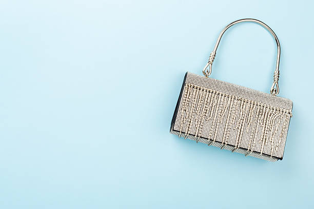istock Handbag with beads on color background, top view 2247955813
