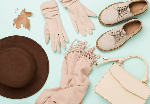 Stylish autumn accessories on color background, top view
