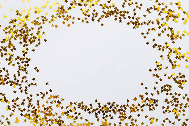 istock Golden star shape confetti on color background, top view 2247957083