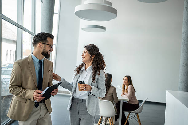 istock Business colleagues networking during office coffee break 2247958474