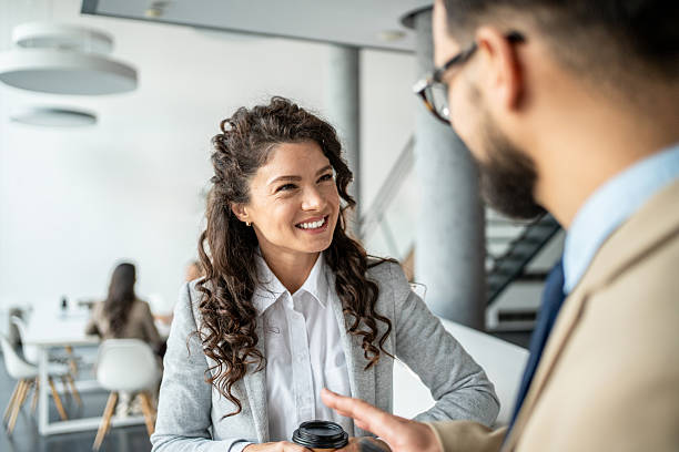 istock Smiling business colleagues having an informal coffee break conversation 2247958557
