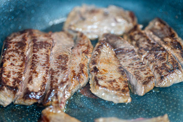 istock Macro shot of sizzling meat in a pan 2247958945