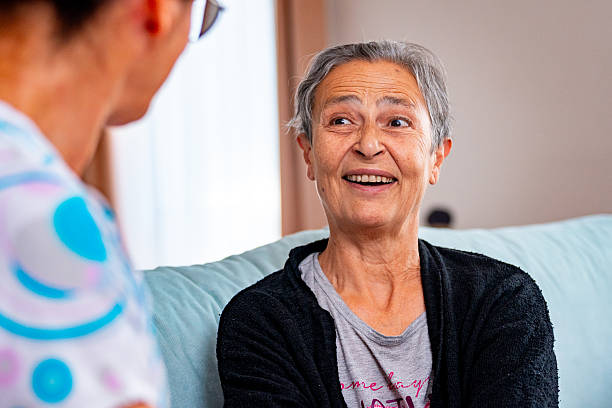 istock Elderly Woman Engaging in Friendly Conversation With Caregiver 2247960450