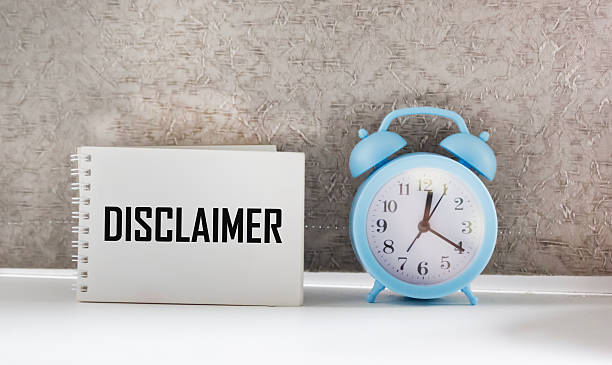 istock White paper with text Disclaimer lying on the keyboard. 2247963923