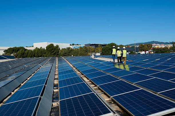 istock Engineers inspecting rooftop solar panels generating green energy 2247965875