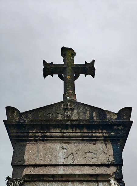 istock Cross over a grave in the cemetery 2247966656
