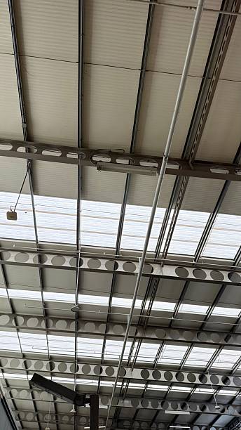 istock Large Industrial Roof with Skylight Panels – Structural Ceiling View 2247966934