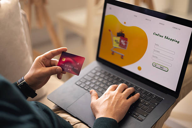 istock Close up man using laptop, shopping online, pay by credit card 2247967502