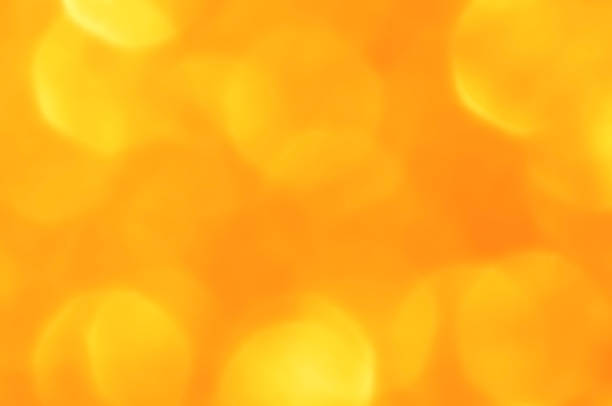 Abstract gold yellow bokeh background. Concept for New Year, Christmas, Celebration and Wedding Anniversary.