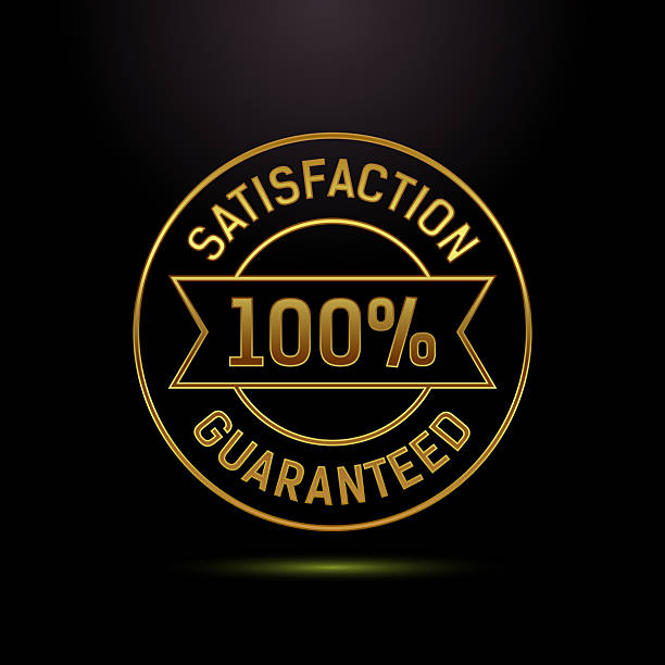 istock Golden one hundred percent guaranteed badge on a black backdrop 2247975810