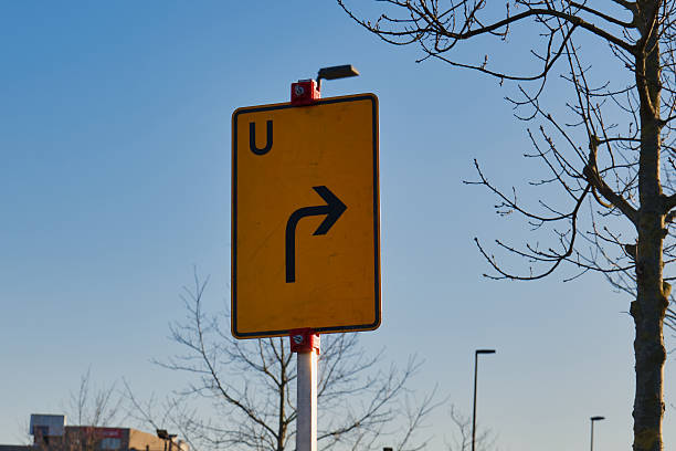 istock Turn right sign guiding drivers in Neuss, Germany on a clear day 2247976523