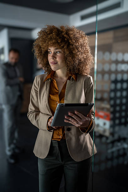 istock Confident businesswoman using digital tablet in office 2247977350
