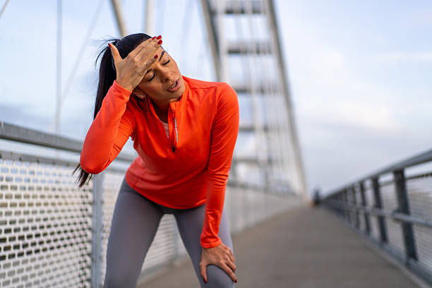 istock Woman feeling exhausted after intense running workout 2247978499