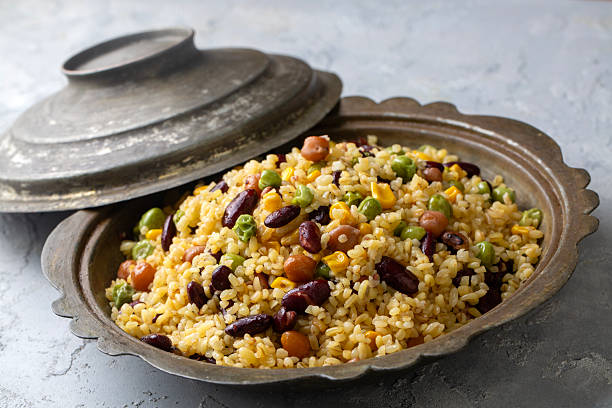 istock Bulgur pilaf with legumes; with peas, beans and corn kernels. 2247980516