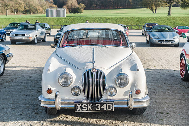 Vintage, luxury, convertible car parked on riverbank, Lisbon