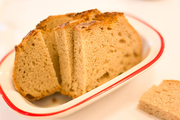 The slices of toast bread filling the picture are spread out on the table