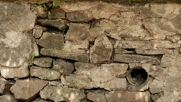 istock A natural, rugged, aged gray and beige dry stacked stone 2247985387