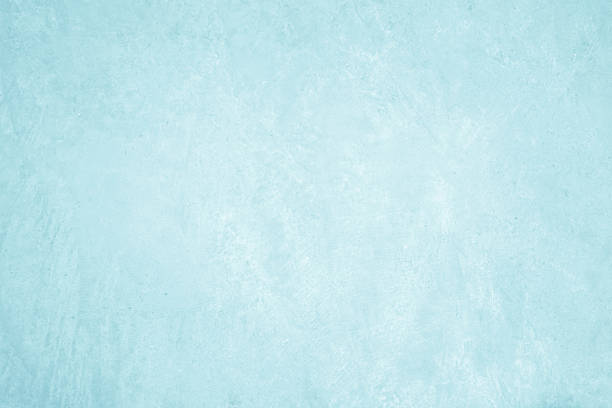 Pastel blue and white concrete stone texture for background in summer wallpaper. Concrete abstract wall of light cyan color, cement texture for design.