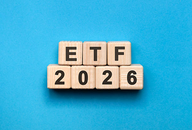 istock New year ETF 2026 concept. Wooden cubes on a blue background 2247993187