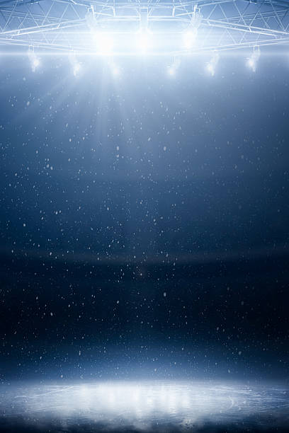 istock Blue background. Vertical. Stage ice podium with blue spotlights, smoke, and glitter on a dark background. Theatrical performance and awards ceremony concept. Sports backdrop 2247995338