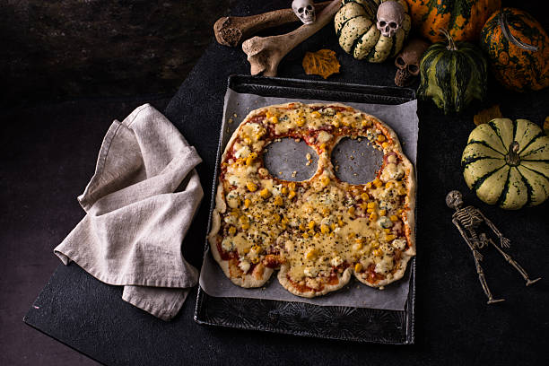istock Halloween scary pizza in shape of ghost 2247995994
